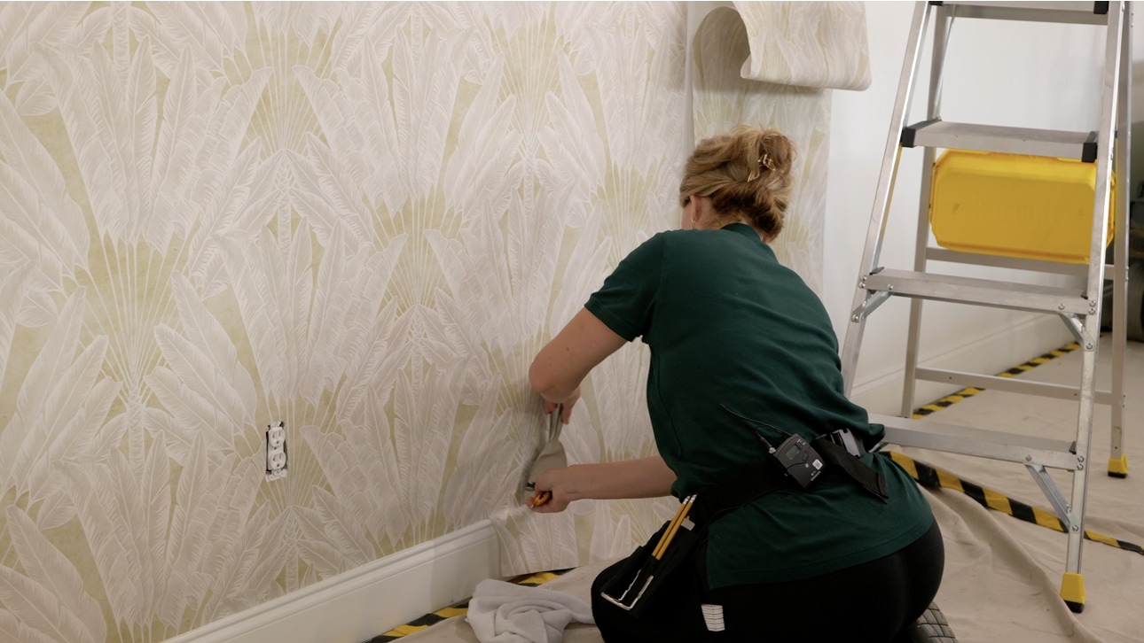 Professional wallpaper installation in a bright interior